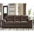 Canapé 3 places capitonné en similicuir beige/chocolat avec accoudoirs à plateau-coussin